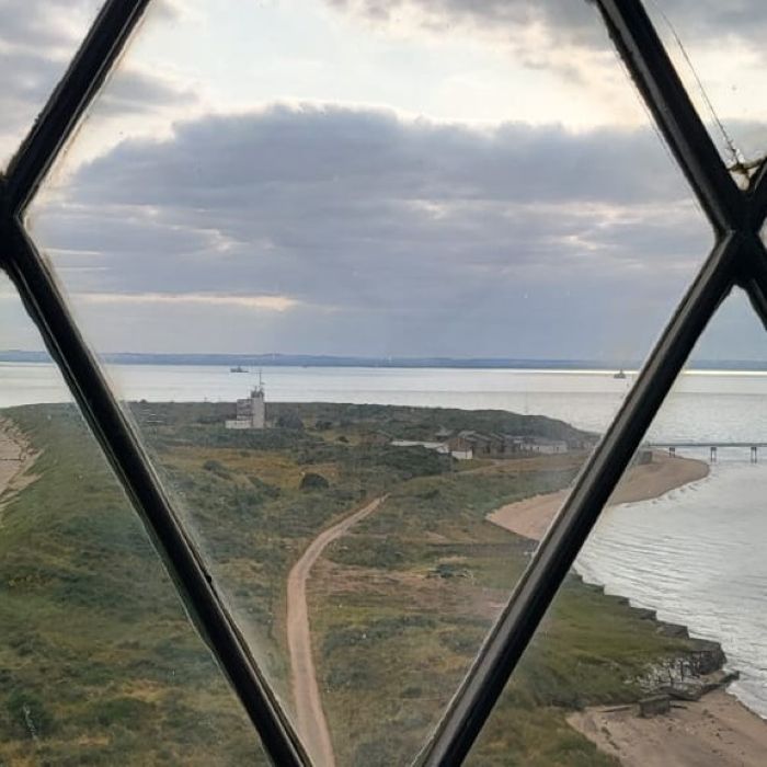 The view from the top of Spurn Point Lighthouse, looking out at the narrow sand 
                    and shingle spit extending into the Humber Estuary